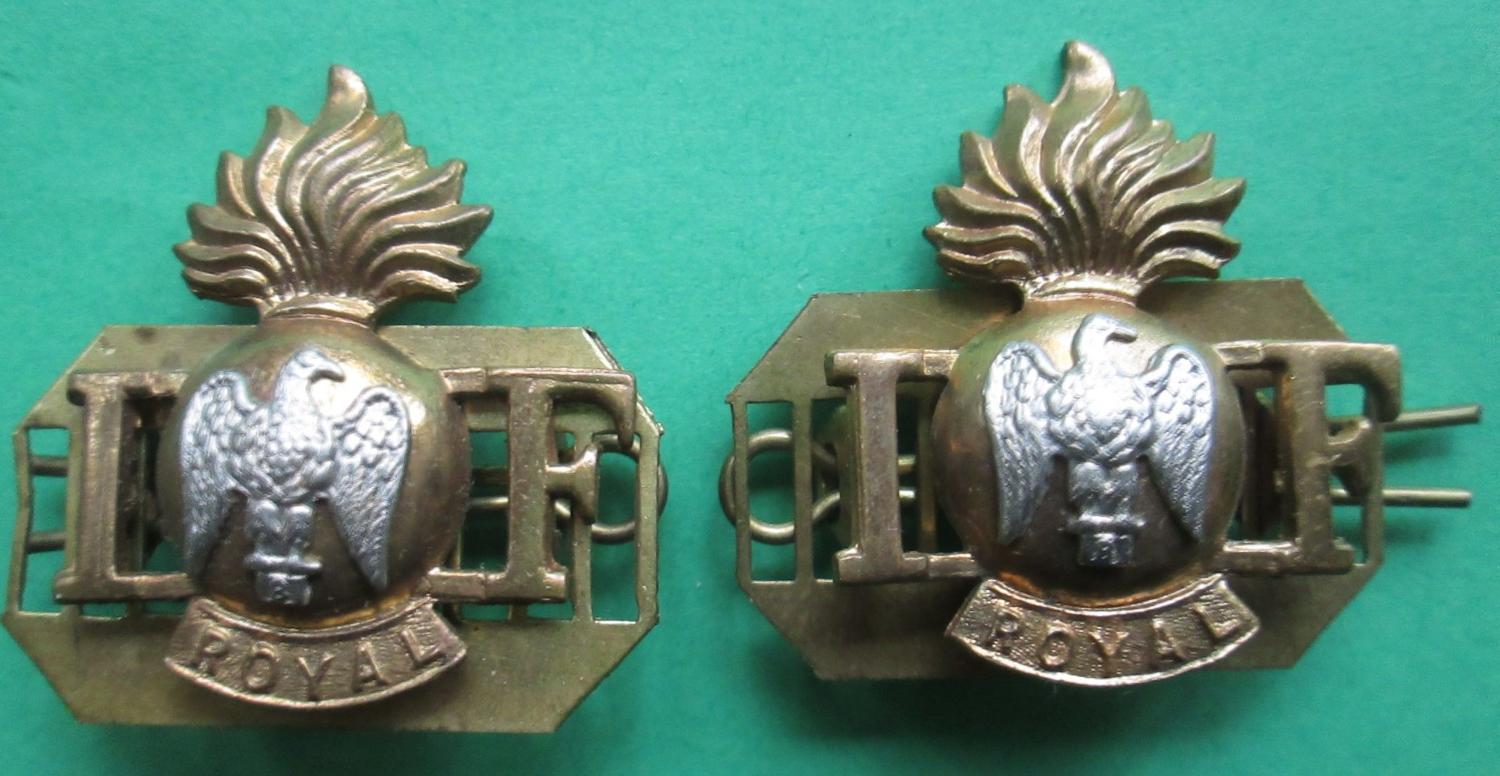A PAIR OF ROYAL IRISH FUSILIERS SHOULDER TITLES