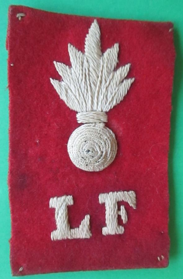A WWI PERIOD LANCASHIRE FUSILIERS PAGRI BADGE