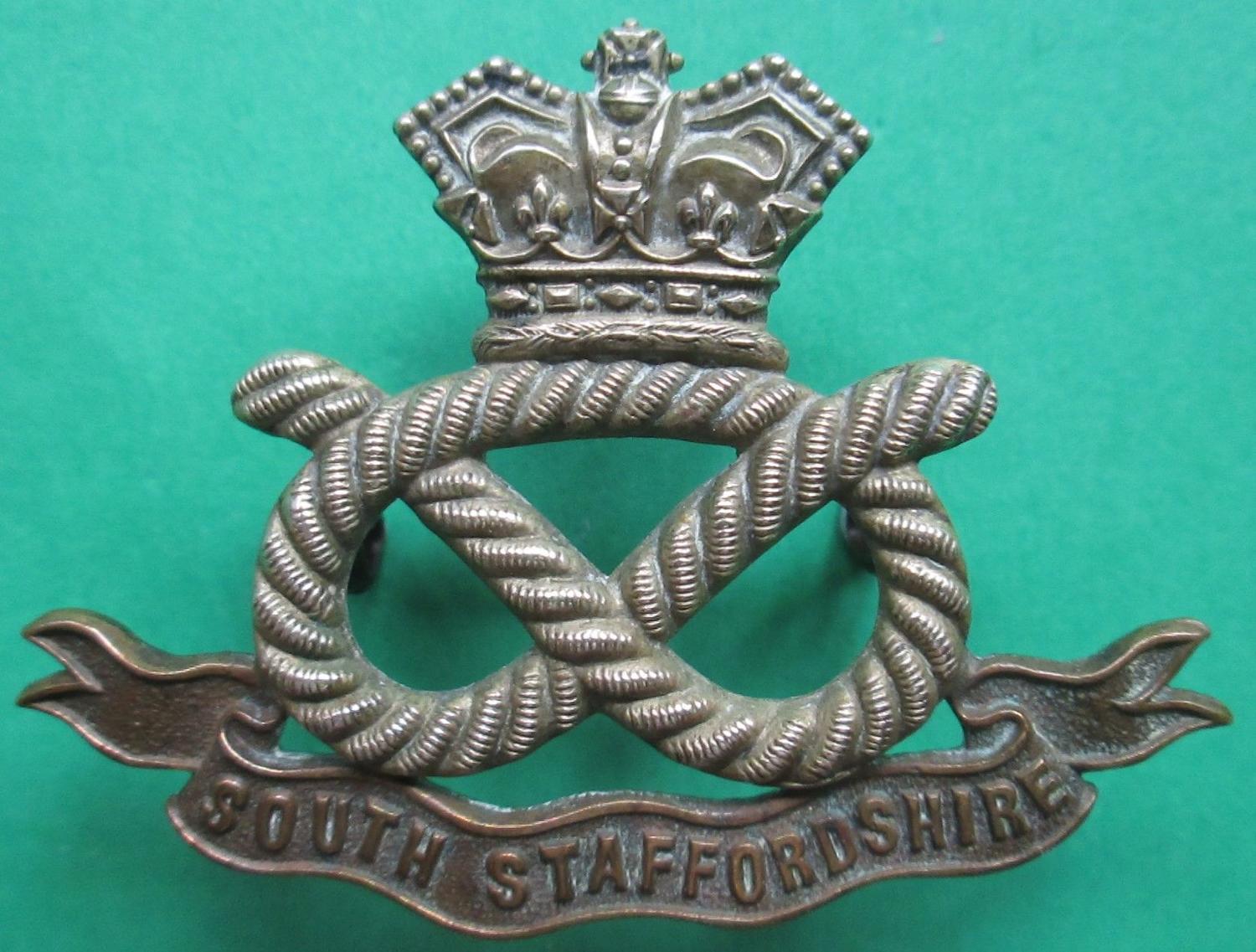 A VICTORIAN OTHER RANKS SOUTH STAFFORDSHIRE CAP BADGE