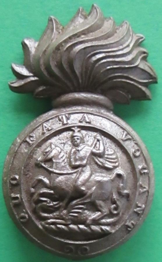 A WWII PLASTIC ROYAL NORTHUMBERLAND FUSILIERS CAP BADGE