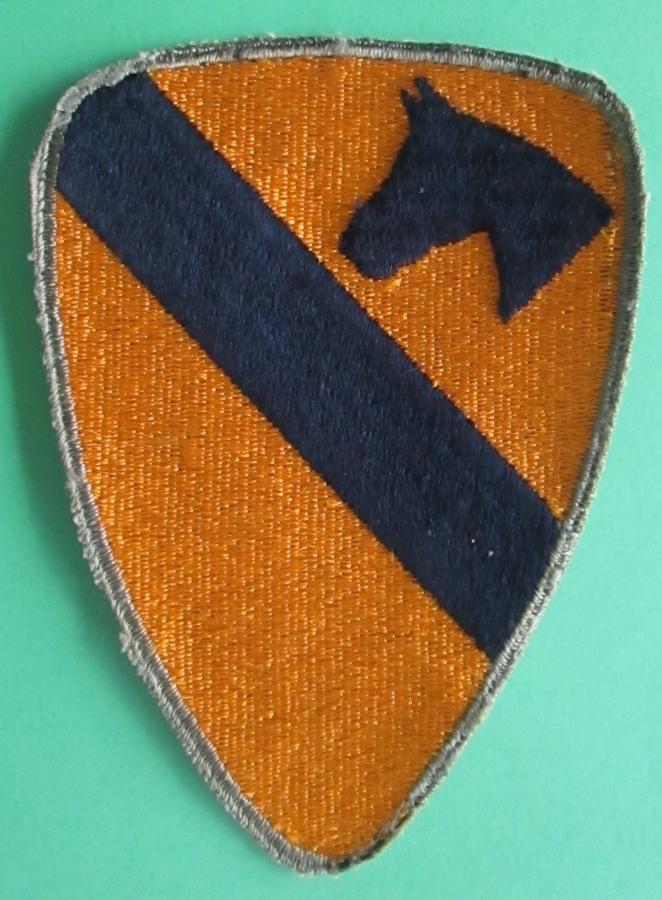 A VERY GOOD WWII US 1ST CAVALRY ARM BADGE GREEN BACK
