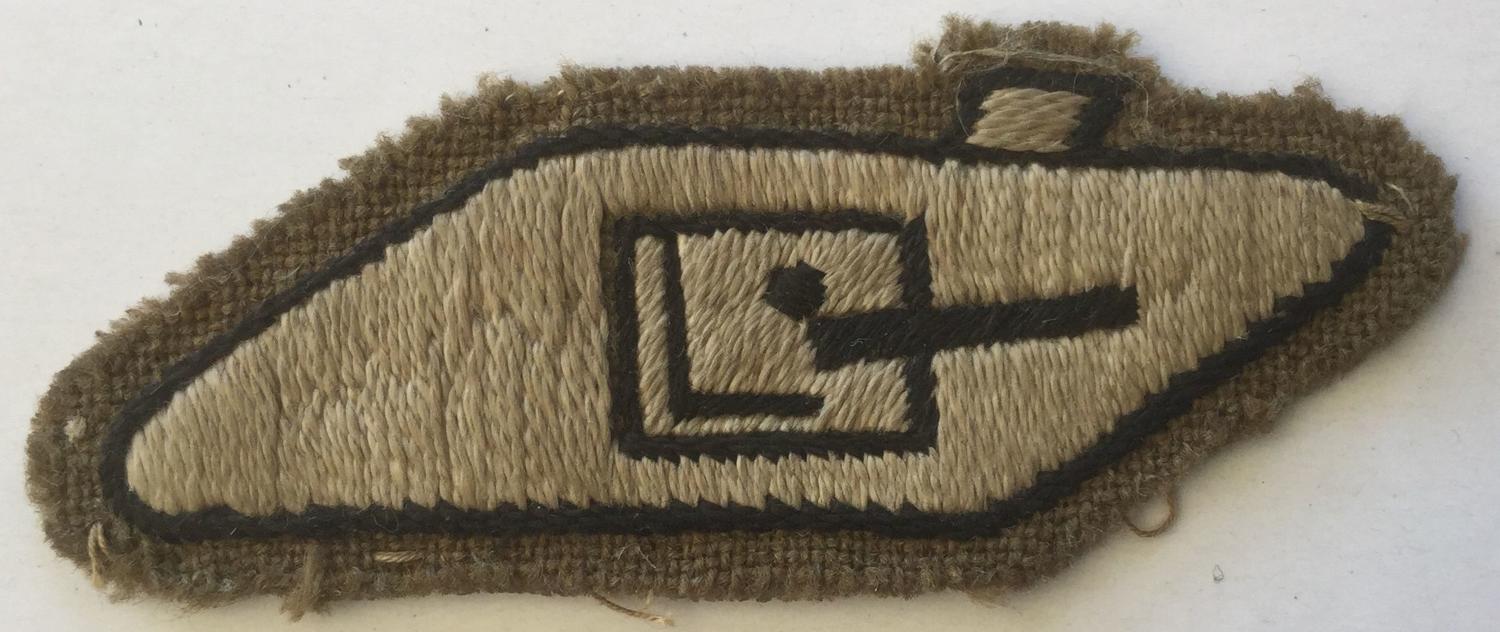 A WWII TANK CREWMAN'S ARM BADGE