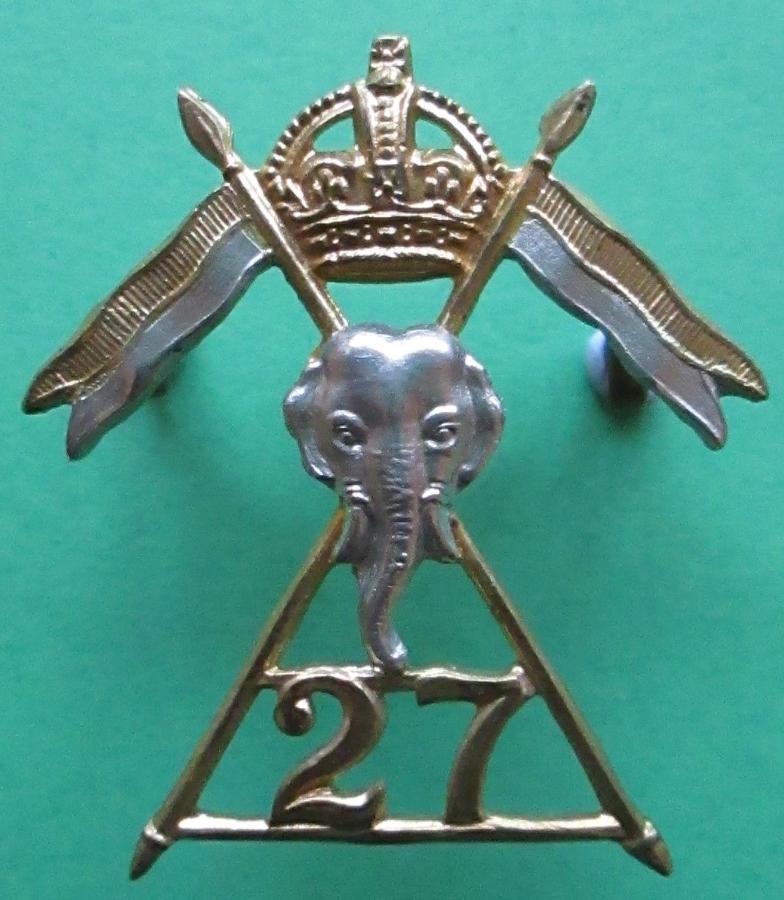 A RARE OFFICERS SILVER AND GILT 27TH LANCERS CAP BADGE