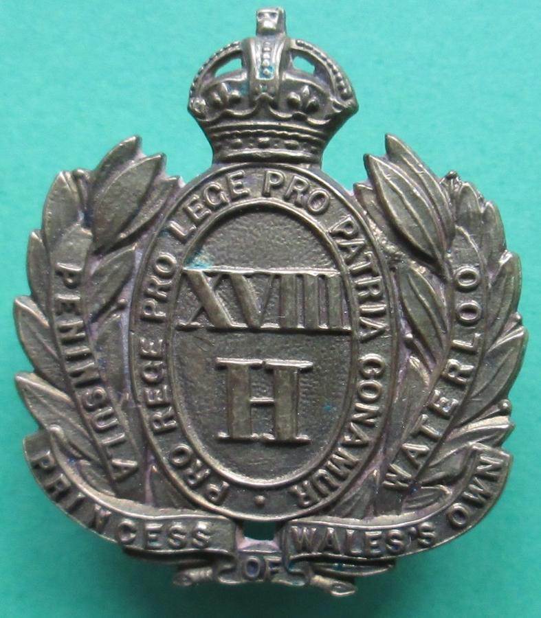 A 18TH HUSSARS OFFICERS GILT CAP BADGE