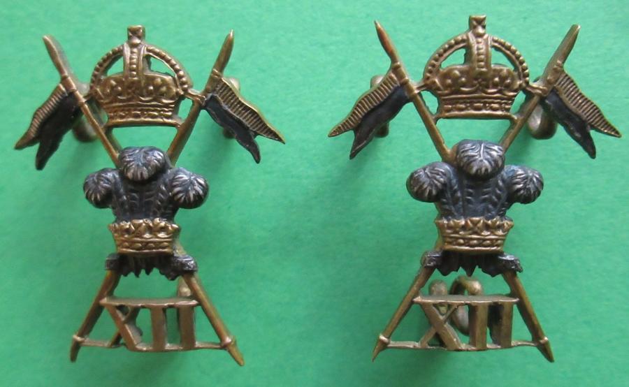 A PAIR OF 12th LANCERS OFFICERS SILVER AND GILT COLLAR DOGS