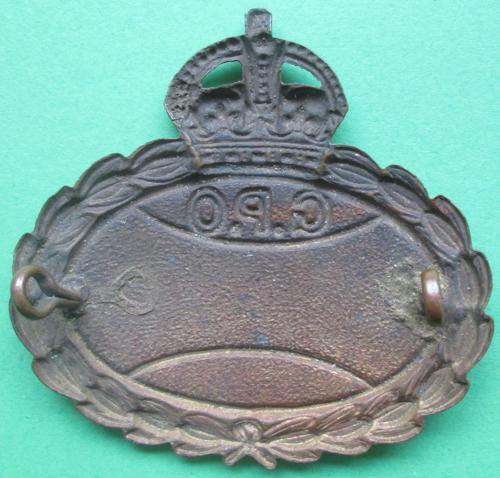 A PRE 1952 G.P.O BADGE WITH KING'S CROWN