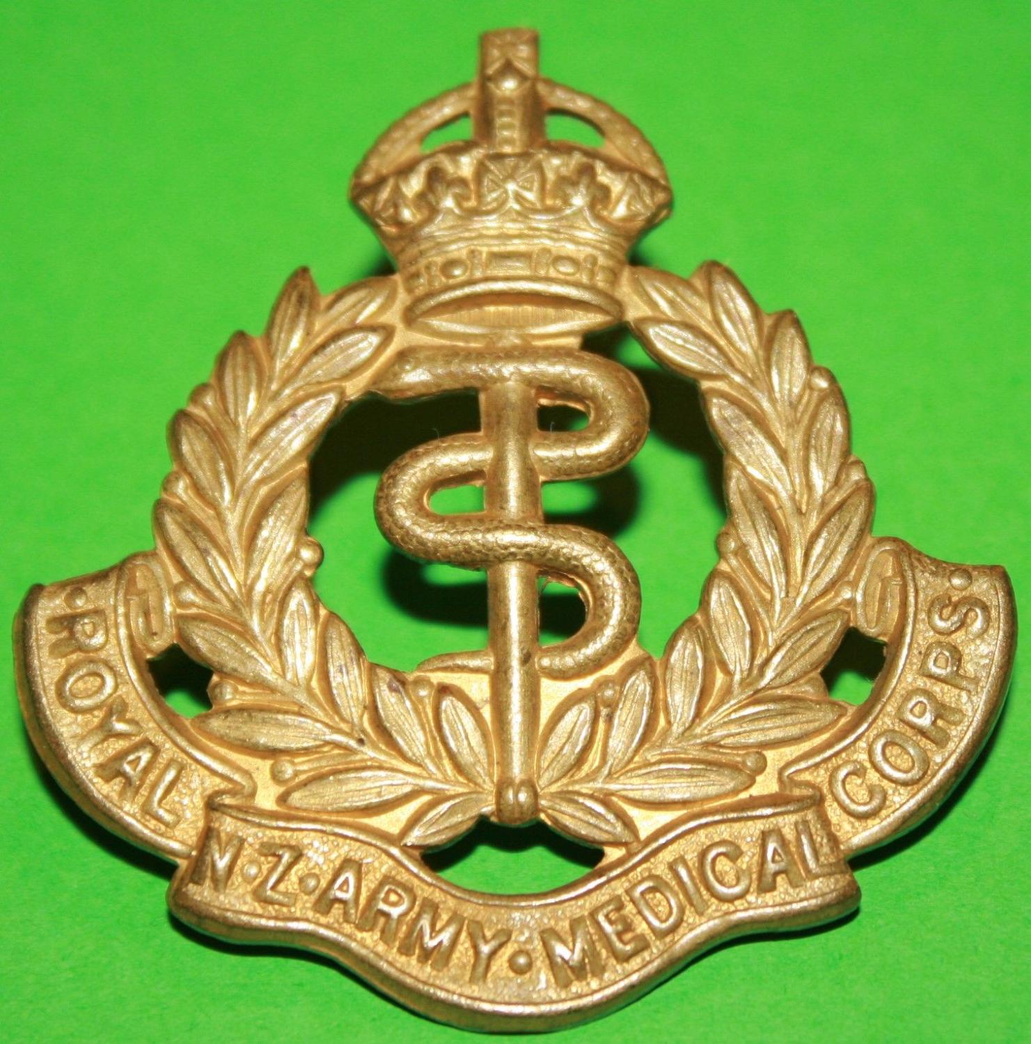 A WWII PERIOD ROYAL CANADIAN ARMY MEDICAL CORPS CAP BADGE