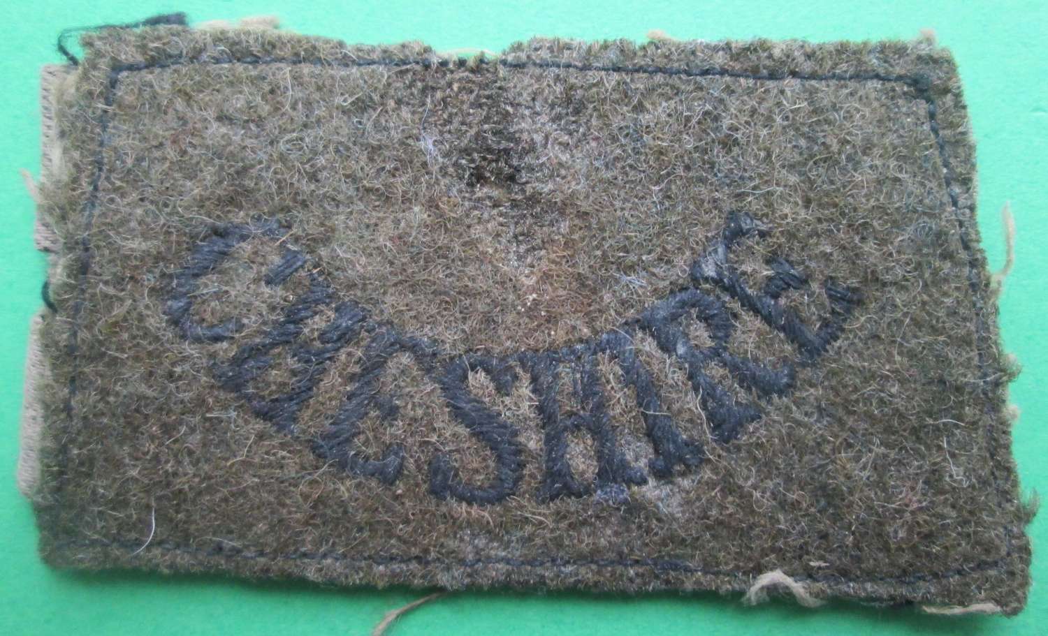 AN EARLY CHESHIRE SLIP ON SHOULDER TITLE