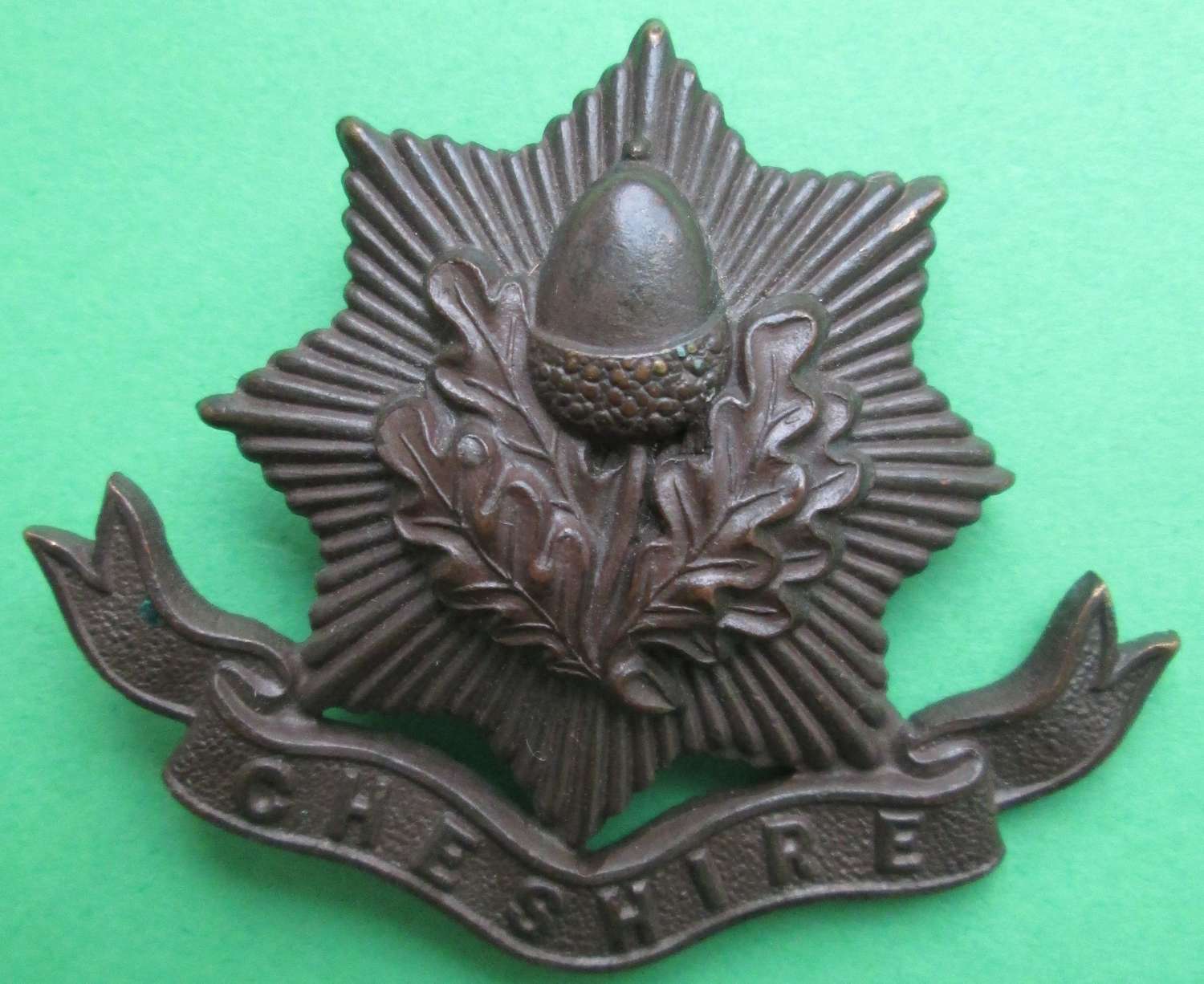A CHESHIRE REGIMENT OFFICERS BRONZE BADGE