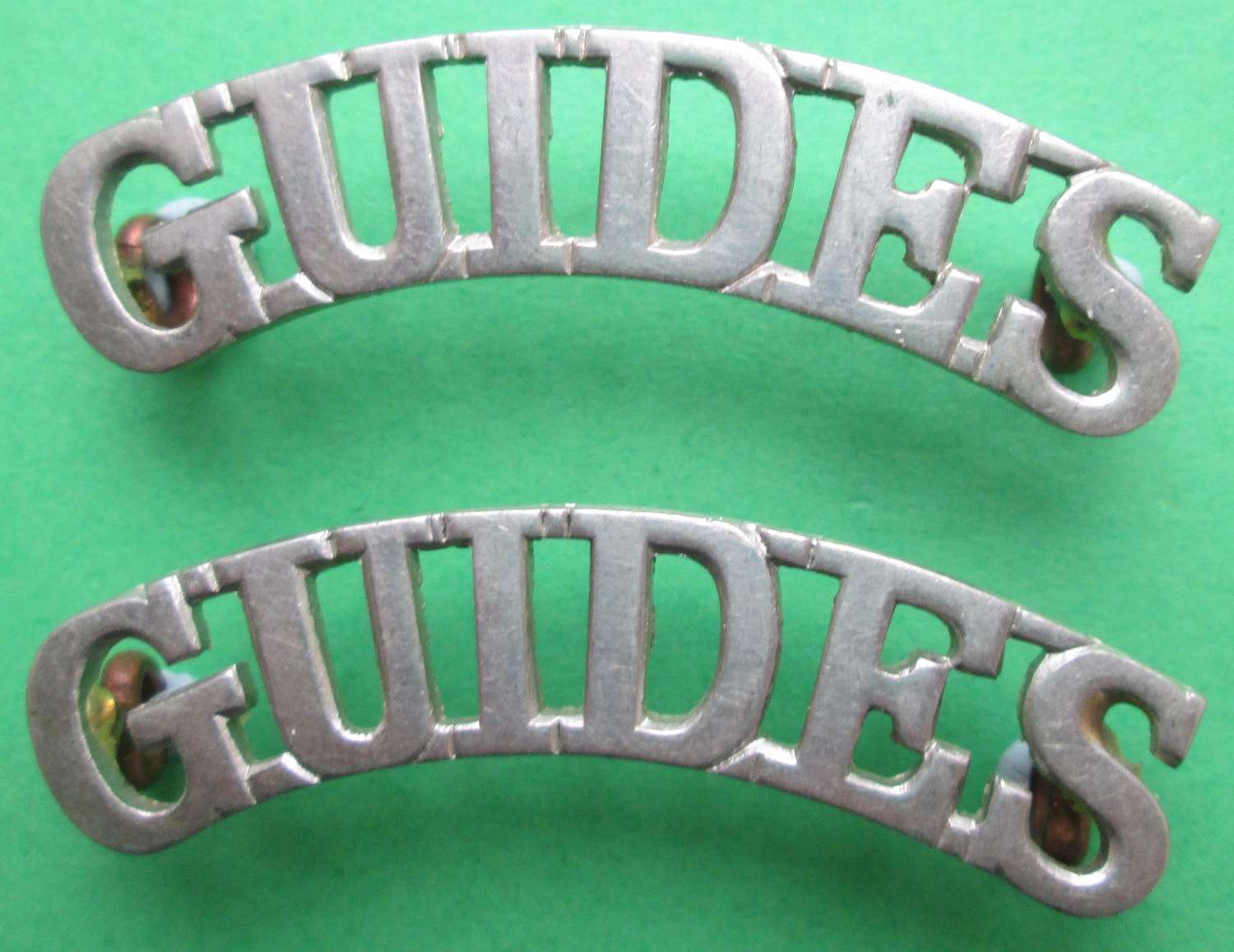 QUEEN VICTORIA'S OWN CORPS OF GUIDES WHITE METAL SHOULDER TITLES 