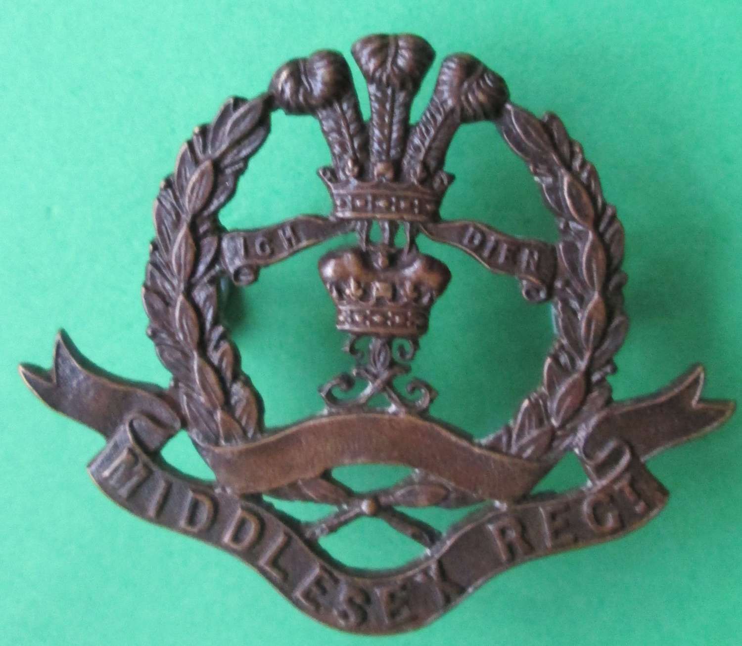 A 10TH MIDDLESEX TERRITORIAL REGT BADGE MADE BY JENNINGS AND CO