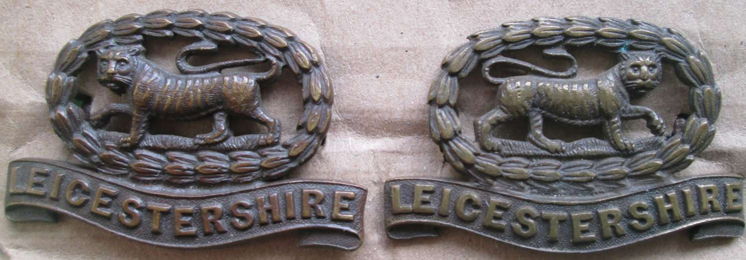 A PAIR OF OFFICERS LEICESTERSHIRE COLLAR DOGS