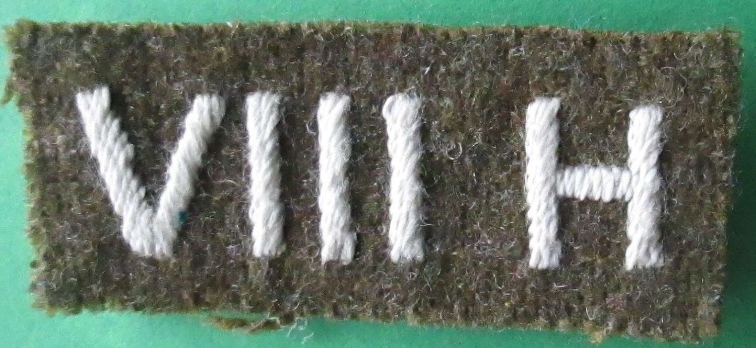 A WWII 8TH HUSSARS SHOULDER TITLE