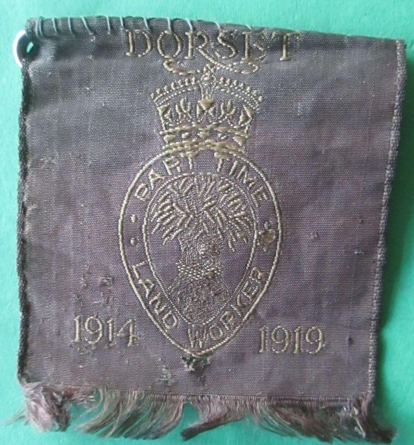 A WWI PERIOD PART TIME DORSET LAND WORKERS ARM BADGE