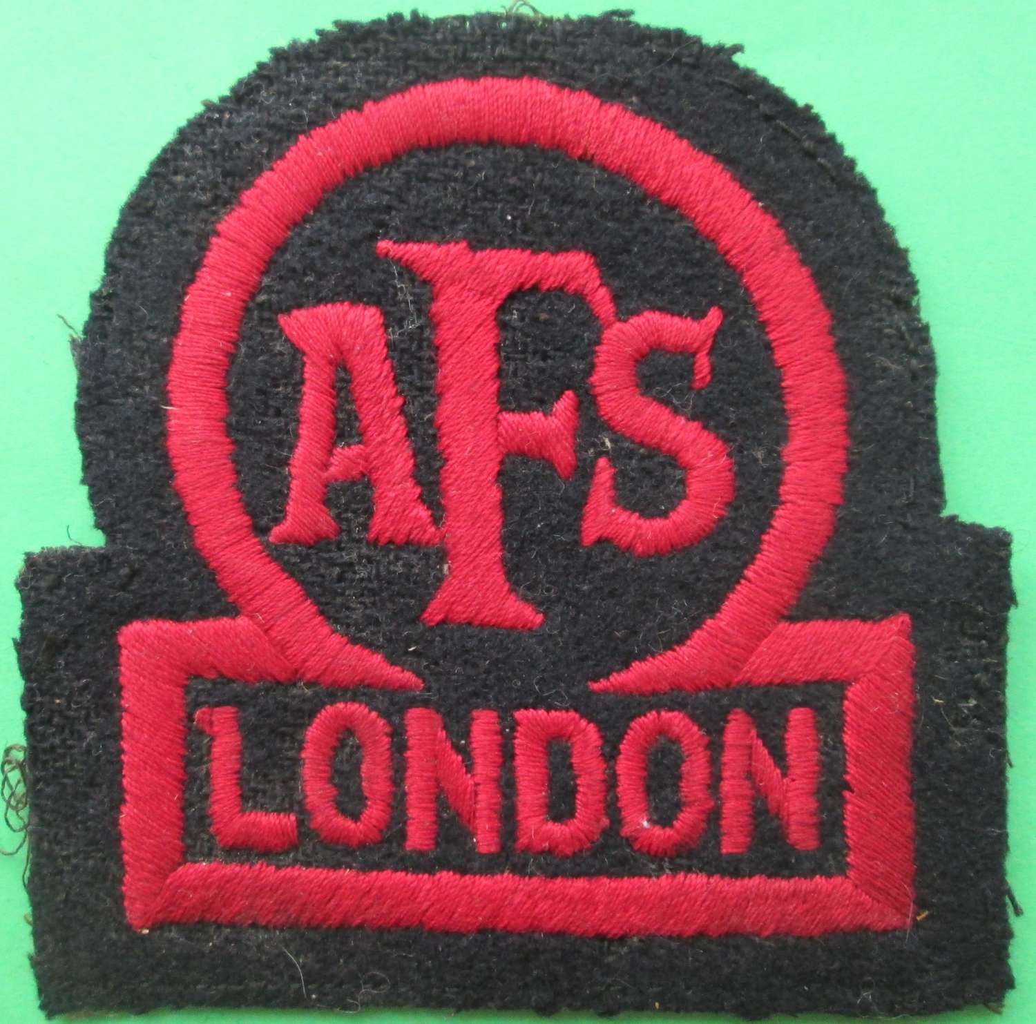 AN AUXILLARY FIRE SERVICE BADGE FOR LONDON