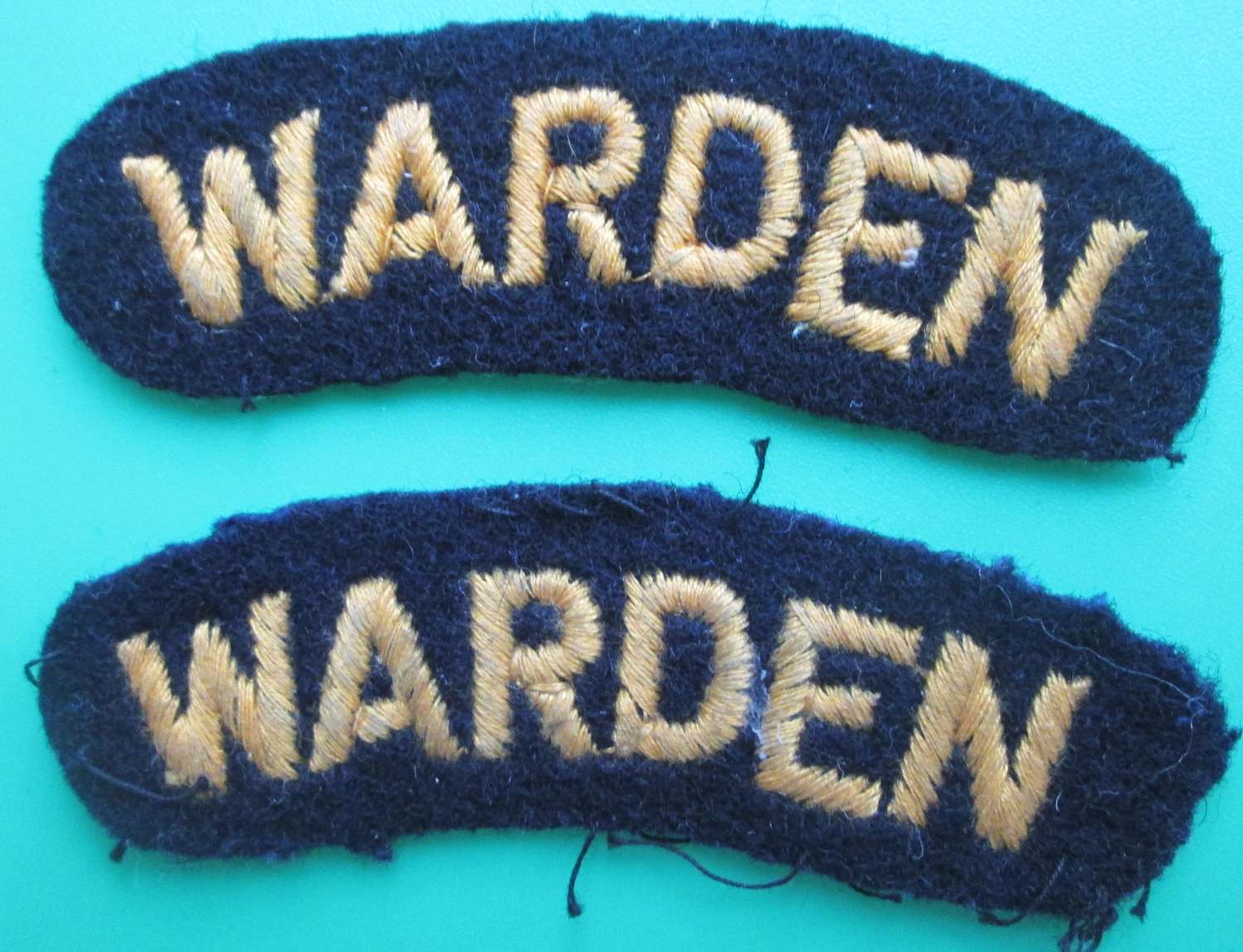 A PAIR OF WWII AIR RAID WARDENS SHOULDER TITLES
