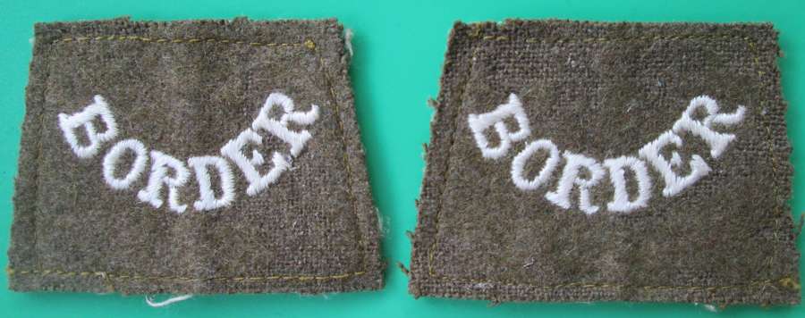 A PAIR OF WWI PERIOD BORDER REGIMENT SLIP ON TITLES