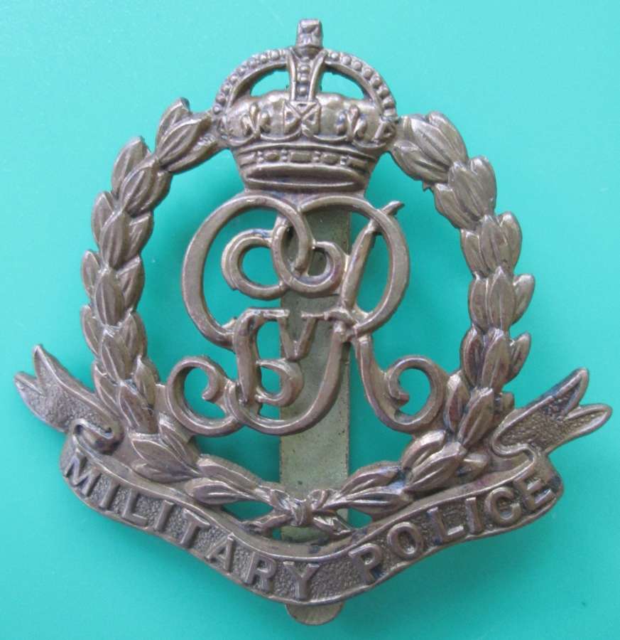 A MILITARY POLICE CAP BADGE