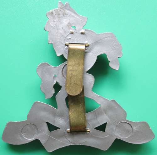 A WWII PERIOD ROYAL WEST KENT PLASTIC ECONOMY CAP BADGE