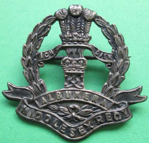 A 1915 SILVER MIDLESEX REGT 1915 HALLMARKED BADGE