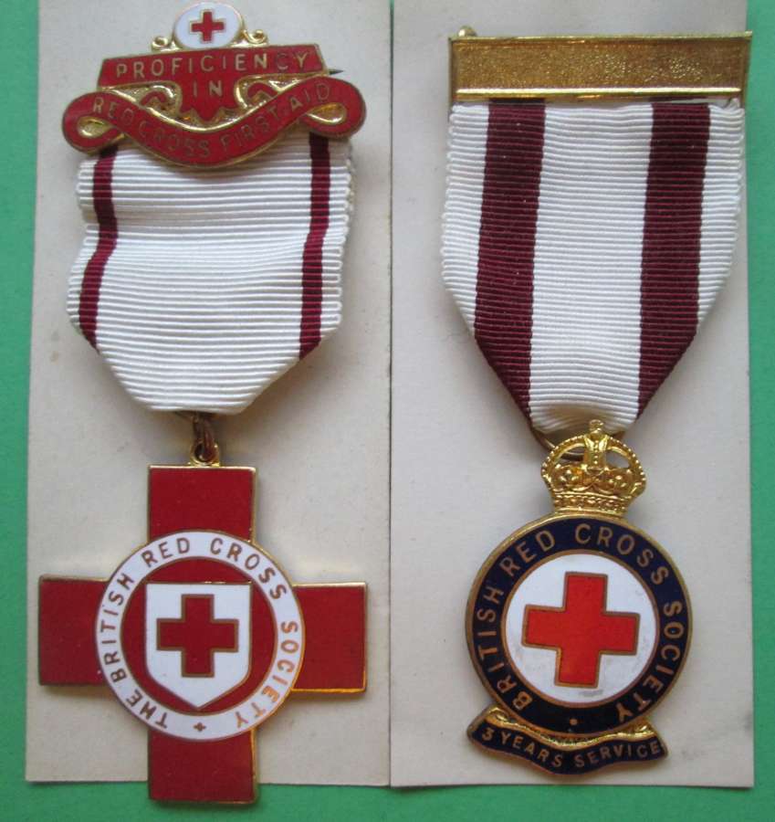 A PAIR OF WWII BRITISH RED CROSS MEDALS TO A MISS M A LINES IN BOXES