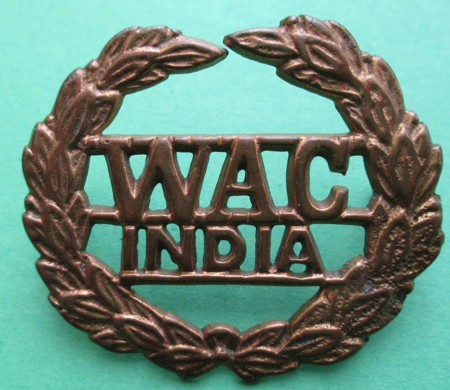 A WOMEN'S ARMY CORPS INDIA CAP BADGE