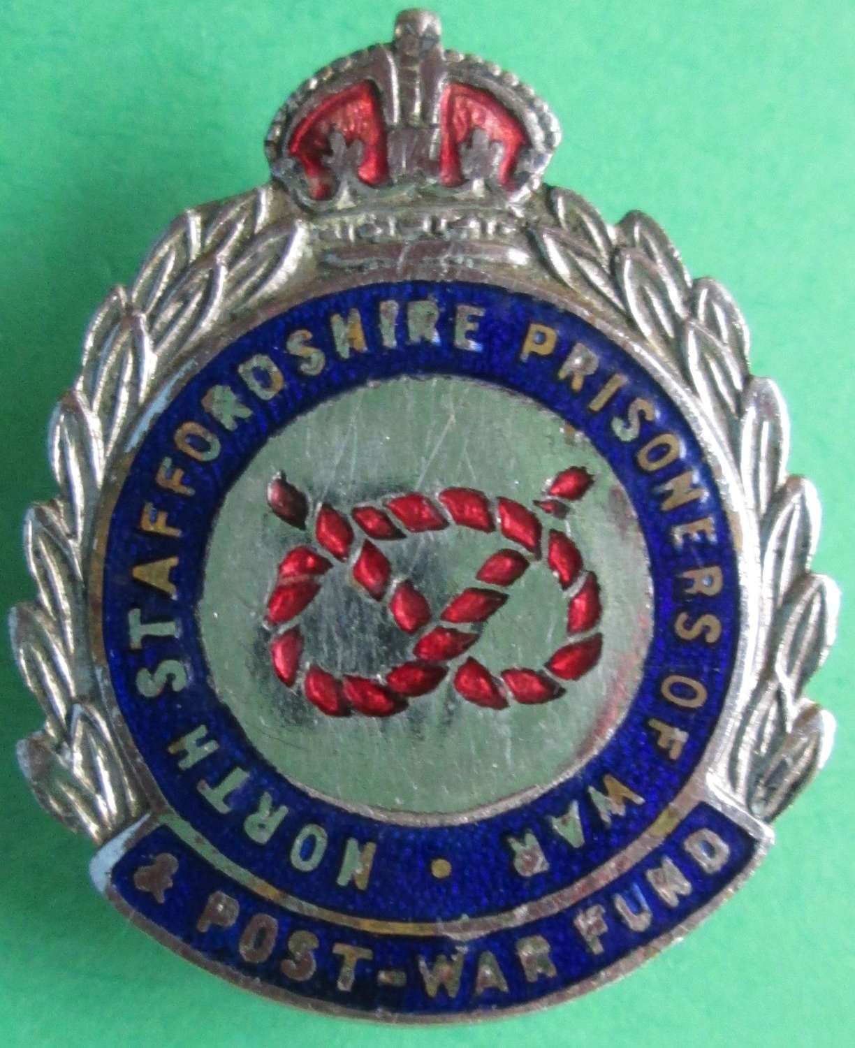 A NORTH STAFFORDSHIRE PRISONERS OF WAR AND POST WAR FUND BADGE