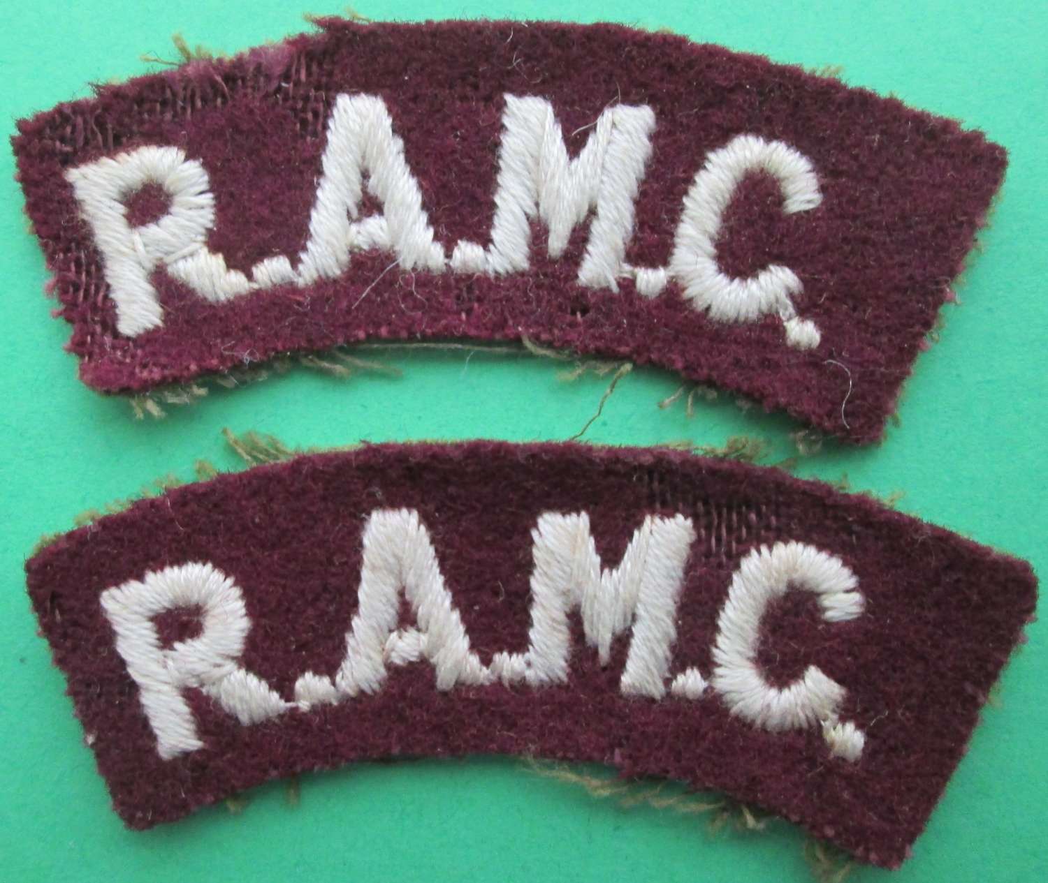 A PAIR OF ROYAL ARMY MEDICAL CORPS SHOULDER TITLES