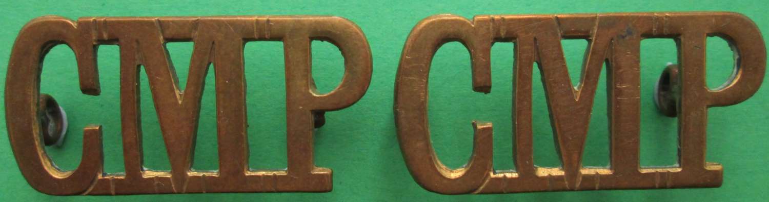 A PAIR OF LARGE CMP ( CORPS OF MILITARY POLICE ) METAL SHOULDER TITLES