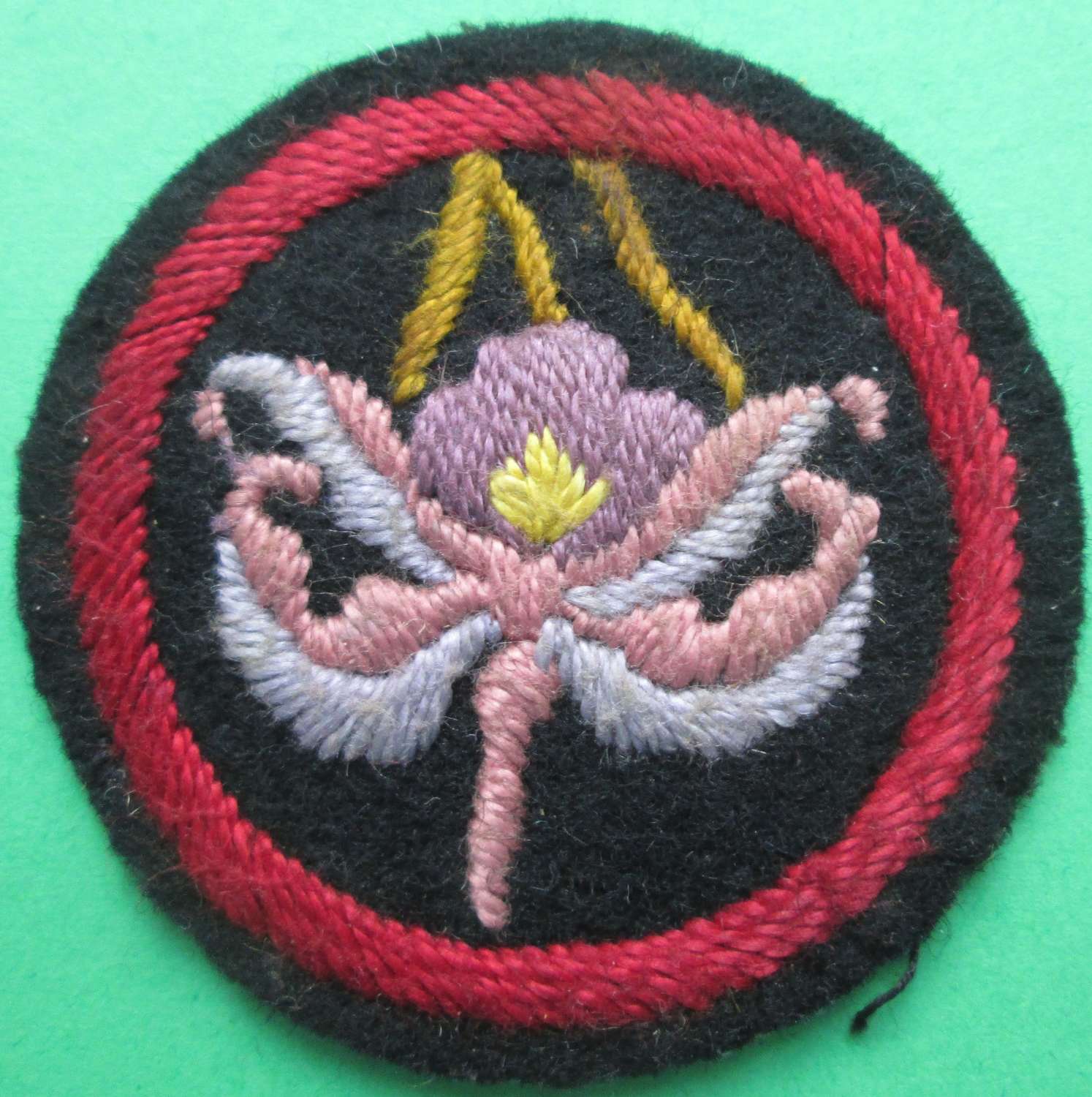 A NICE PRE 1930 GIRL GUIDES ORCHID PATROL BADGE