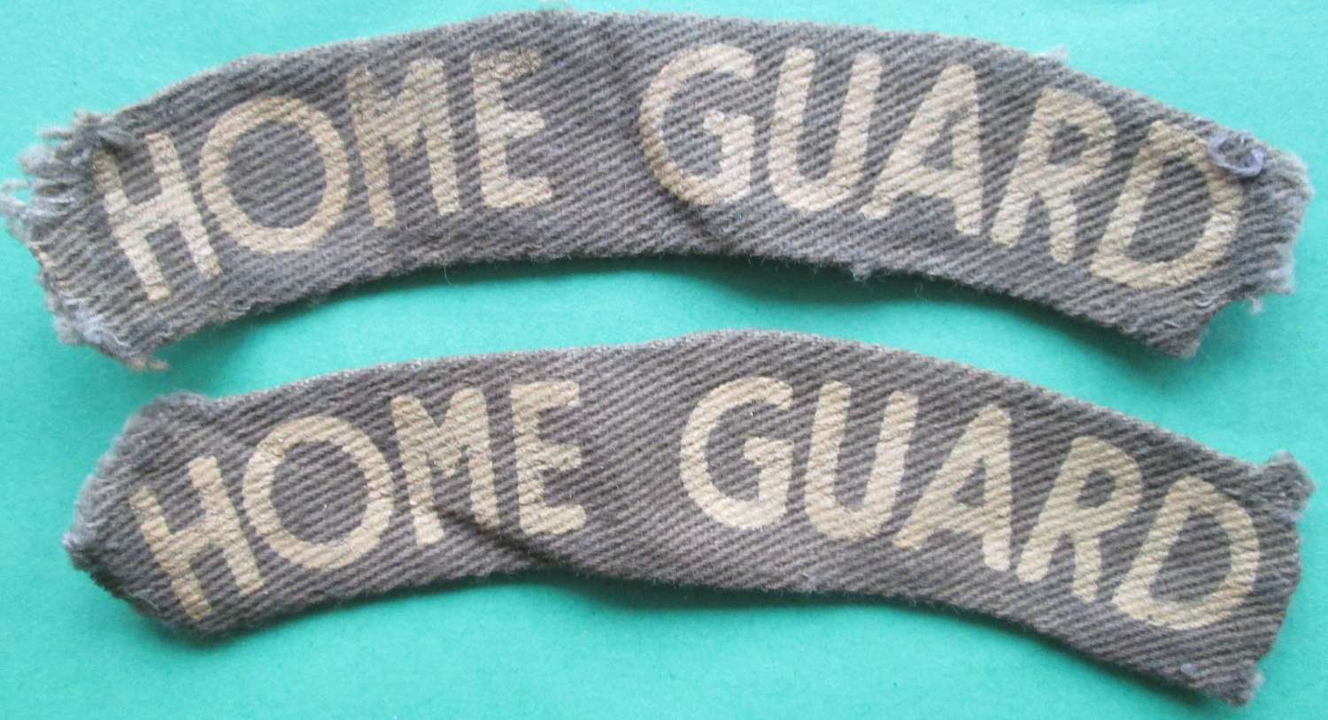 A PAIR OF PRINTED HOME GUARD SHOULDER TITLES