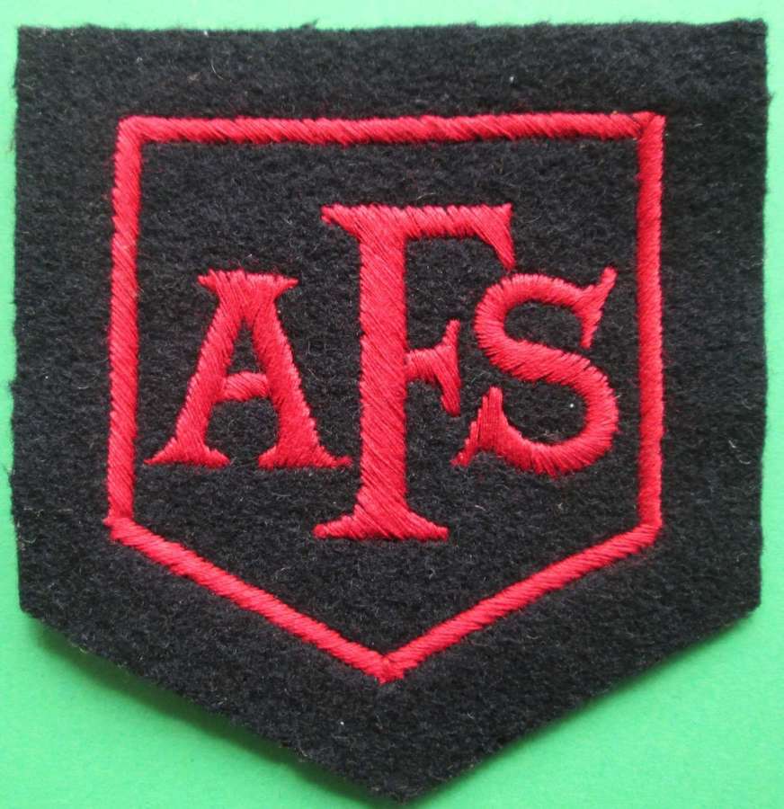 AN AUXILLERY FIRE SERVICE BREAST BADGE
