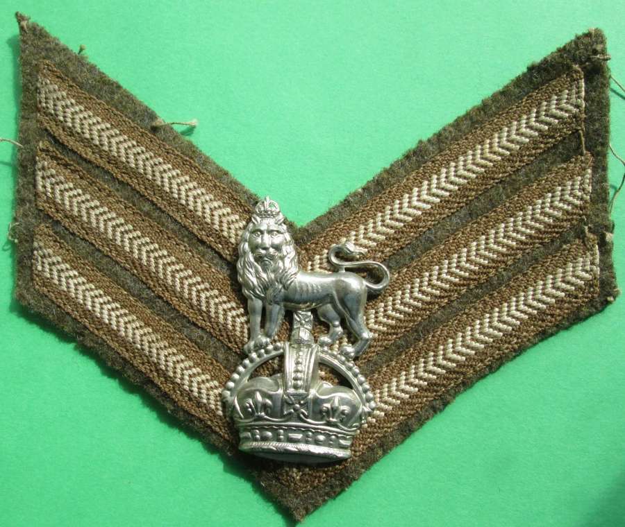 A 15TH/19TH HUSSARS ARM BADGE ATTACHED TO SGTS STRIPES