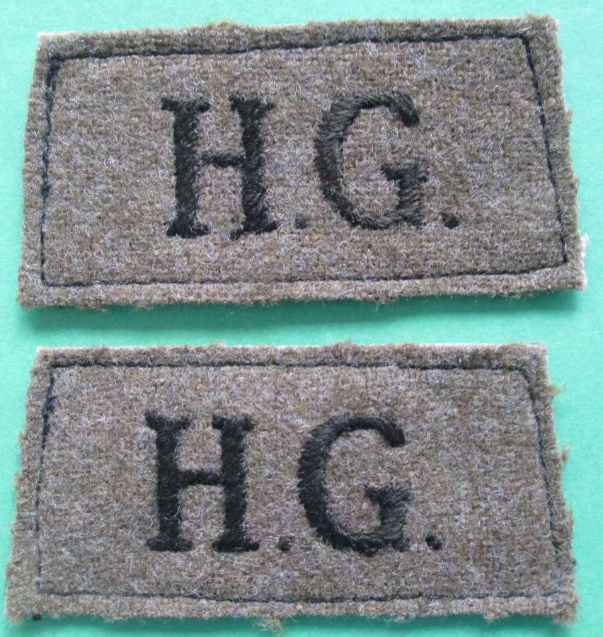 A PAIR OF SLIP ON HOME GUARD SHOULDER TITLES