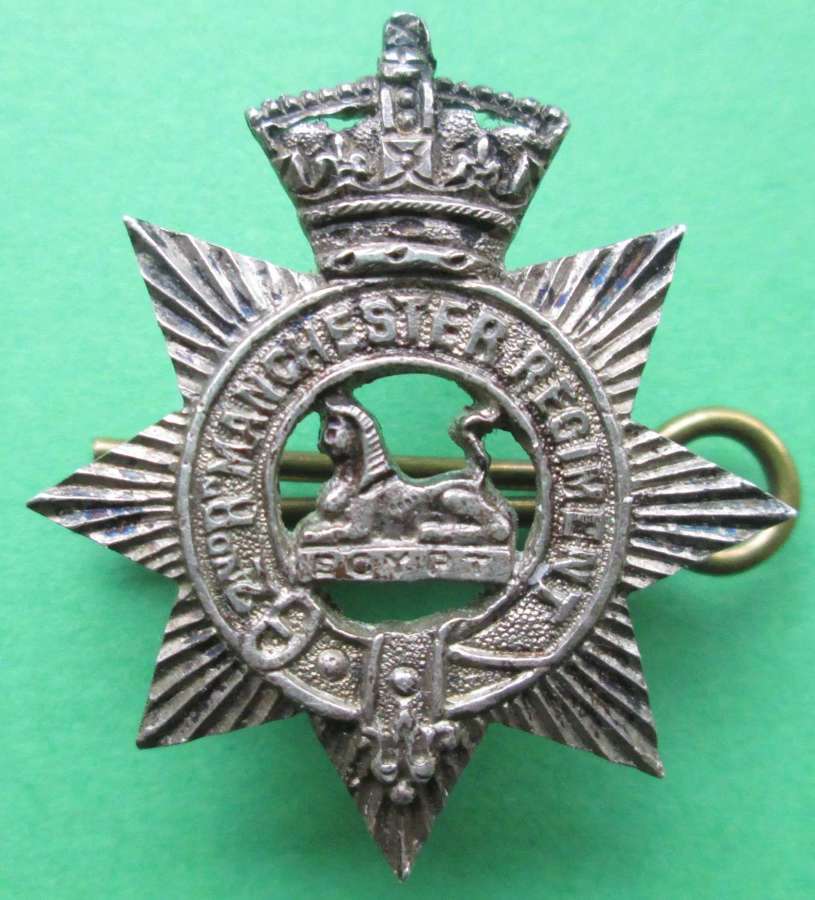 A SILVER OFFICERS COLLAR BADGE MANCHESTER REGIMENT