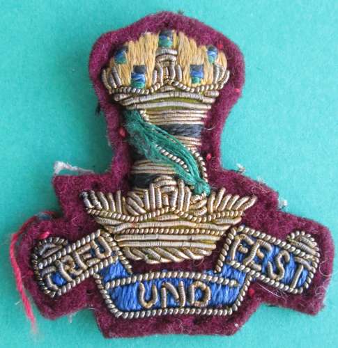 An 11TH HUSSARS COLLAR BADGE